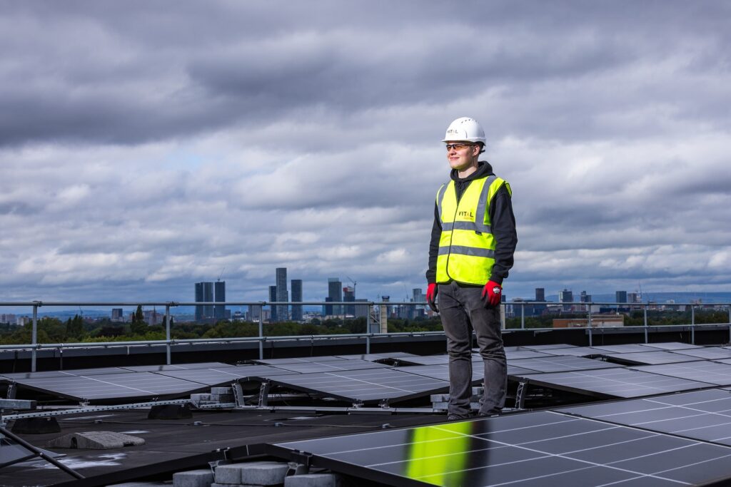 A solar installer performing maintenance and inspection on solar panels, ensuring the optimal performance of a solar system.